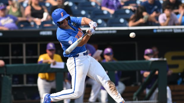Jun 25, 2023; Omaha, NE, USA; Florida Gators center fielder Wyatt Langford (36) drives in a run with a double against the LSU Tigers in the eighth inning at Charles Schwab Field Omaha. Mandatory Credit: Steven Branscombe-USA TODAY Sports